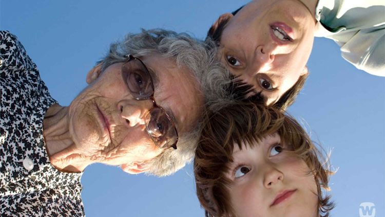 grandmother looking down in camera with her children 1920 1080