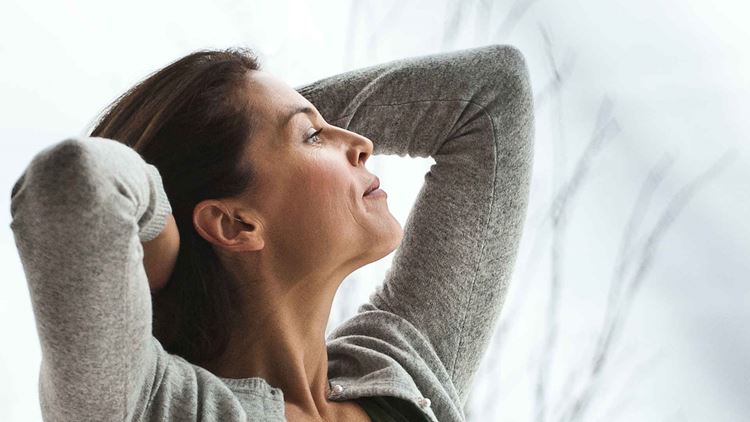 women stretching with arms behind head v2 1920x1080